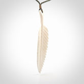 A hand carved large bone fern leaf necklace. A beautiful large fern leaf pendant carved from bone for NZ Pacific. This is a true piece of wearable art and is provided with an adjustable cord.